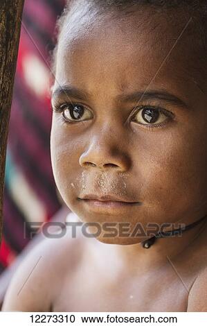 Stock Image - Dani boy, Obia Village, Baliem Valley, Central Highlands of Western New Guinea, Papua, Indonesia. Fotosearch