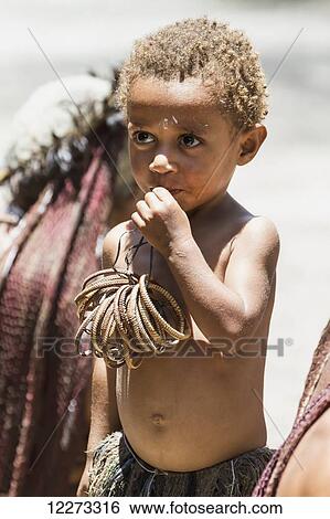 Stock Photograph - Dani boy, Obia Village, Baliem Valley, Central Highlands of Western New Guinea, Papua, Indonesia. Fotosearch