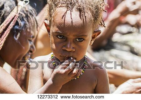 Dani girl, Obia Village, Baliem Valley, Central Highlands of Western New Guinea, Papua, Indonesia View Large Photo Image Stock Image - Dani girl, Obia Village, Baliem Valley, Central Highlands of Western New Guinea, Papua, Indonesia. Fotosearch
