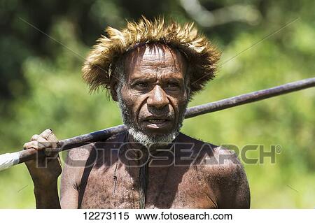Dani man wearing an elaborate headdress of bird of paradise or cassowary feathers, Obia Village, Baliem Valley, Central Highlands of Western New Guinea, Papua, Indonesia View Large Photo Image Stock Photography - Dani man wearing an elaborate headdress of bird of paradise or cassowary feathers, Obia Village, Baliem Valley, Central Highlands of Western New Guinea, Papua, Indonesia. Fotosearch
