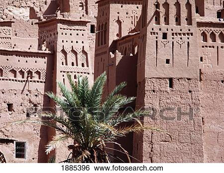 Stock Photograph - Date Palms And The Buildings Of The Kasbahs Of Ait Benahaddou Near Quarzazate. Fotosearch