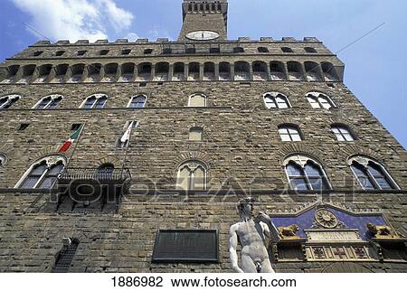 Stock Image - David Statue And Palazzo Vecchio, Low Angle View. Fotosearch