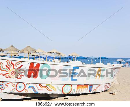 Stock Photo - Decorated Fishing Boat On La Carihuela Beach, Torremolinos, Costa Del Sol, Malaga, Spain. Fotosearch