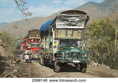 Stock Photo - Decorated Pakistani Trucks With Relief Aid For The Victims Of The 8 October 2005 Earthquake, Chinari, Azad Kashmir, Pakistan. Fotosearch