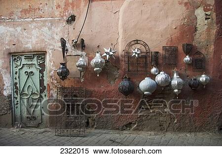 Decorative baubles and metal wall art on display on old wall; Medina, Marrakech, Morocco View Large Photo Image Stock Photography - Decorative baubles and metal wall art on display on old wall; Medina, Marrakech, Morocco. Fotosearch