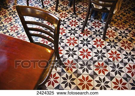 Stock Photography - Decorative black and white pattern on the flooring of a restaurant; Paris, France. Fotosearch