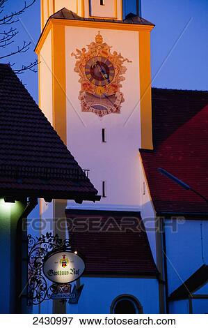 Stock Photo - Decorative design painted around a clock on a tower; Seefeld, Bavaria, Germany. Fotosearch
