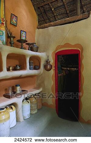 Stock Image - Decorative items on a shelf inside a home; Ulpotha, Embogama, Sri Lanka. Fotosearch