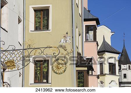Decorative metal building sign against colourful buildings and blue sky; Rattenberg, Austria View Large Photo Image Stock Image - Decorative metal building sign against colourful buildings and blue sky; Rattenberg, Austria. Fotosearch