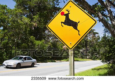 Stock Photo - Deer Crossing Sign With Red Nose; California, Usa. Fotosearch