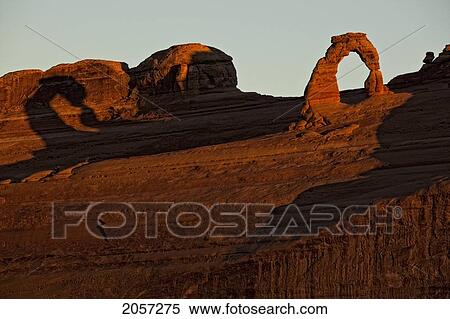 Delicate Arch At Sunrise, Arches National Park, Utah. View Large Photo Image Stock Photography - Delicate Arch At Sunrise, Arches National Park, Utah.. Fotosearch