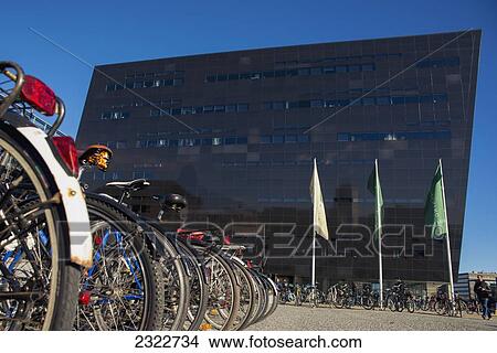 Picture - Denmark, Bicycles parked in front of Royal Library; Copenhagen. Fotosearch