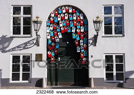 Stock Photo - Denmark, Decorative coloured birdhouses in facade; Copenhagen. Fotosearch