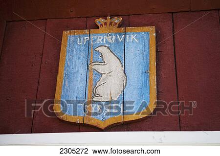 Stock Image - Denmark, Greenland, Coat of arms with polar bear in Upernarvik; Upernarvik. Fotosearch