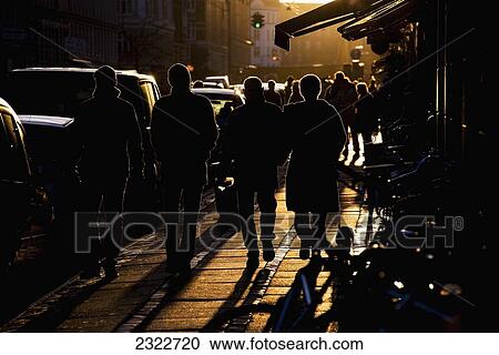 Stock Image - Denmark, Pedestrian in late afternoon light; Copenhagen. Fotosearch