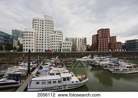 Der Neue Zollhof Office Buildings, Designed By Architect Frank O. Gehry, In Media Harbor, Dusseldorf, North Rhine-Westphalia, Germany View Large Photo Image Stock Image - Der Neue Zollhof Office Buildings, Designed By Architect Frank O. Gehry, In Media Harbor, Dusseldorf, North Rhine-Westphalia, Germany. Fotosearch