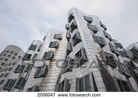 Stock Photo - Der Neue Zollhof Office Buildings, Designed By Architect Frank O. Gehry, In Media Harbor, Dusseldorf, North Rhine-Westphalia, Germany. Fotosearch