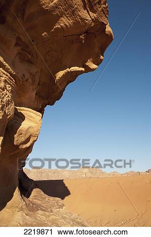 Stock Image - Desert with mountain range in background; Jordan. Fotosearch
