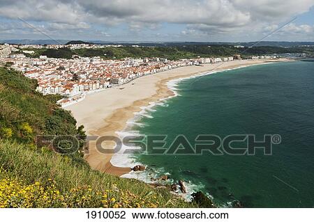 Stock Image - Deserted Beach At The Seaside Town; Nazare, Portugal. Fotosearch