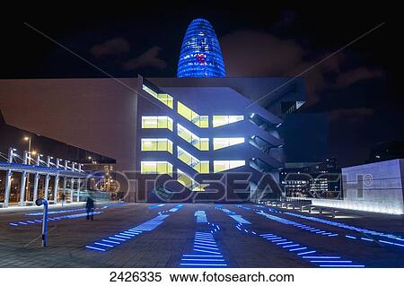 Stock Photography - Design Hub Barcelona and Torre Agbar near Placa de les Glories in Poblenou; Barcelona, Catalonia, Spain. Fotosearch