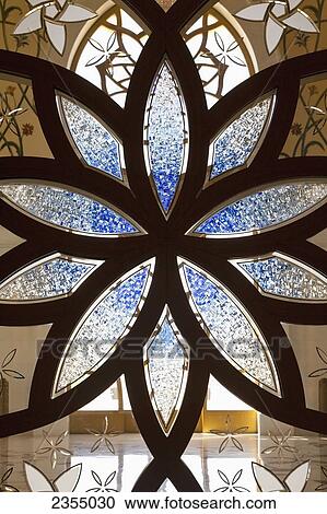 Stock Image - Design on glass in the Sheikh Zayed Grand Mosque; Abu Dhabi, United Arab Emirates. Fotosearch