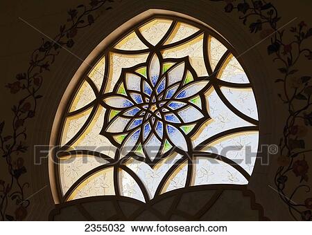 Stock Image - Design on glass in the Sheikh Zayed Grand Mosque; Abu Dhabi, United Arab Emirates. Fotosearch