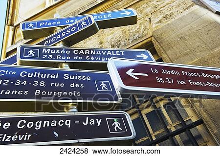 Stock Photo - Destination signs in the historical district of Marais; Paris, France. Fotosearch