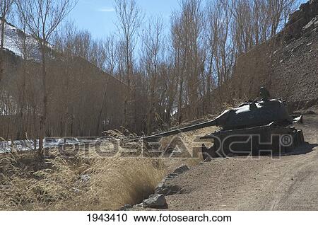 Destroyed Tank On A Road In The Shahidan Valley, Bamian Province, Afghanistan View Large Photo Image Stock Image - Destroyed Tank On A Road In The Shahidan Valley, Bamian Province, Afghanistan. Fotosearch