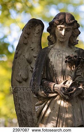 Detail of an angel figurehead covered in moss, Highgate Cemetery; London, England View Large Photo Image Stock Photo - Detail of an angel figurehead covered in moss, Highgate Cemetery; London, England. Fotosearch