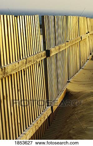 Stock Photo - Detail Of Fence On Beach. Fotosearch