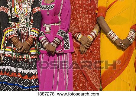 Stock Photo - Detail Of Hands Four Women In Saris. Fotosearch