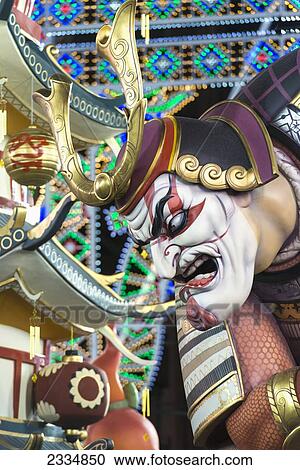 Stock Image - Detail Of Large Falla Of Japanese Lady Being Pulled On Rickshaw By Man Displayed On Street As Part Of Fallas Festival; Valencia, Spain. Fotosearch