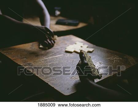 Stock Photo - Detail Of People Playing Dominoes In Bar. Fotosearch