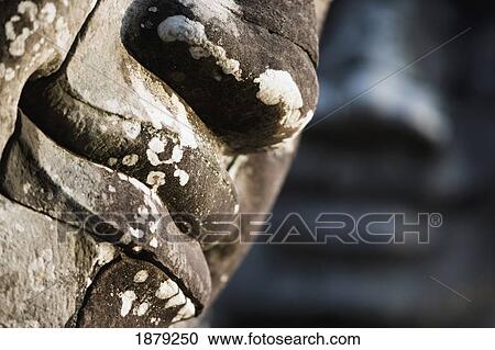 Stock Image - Detail Of Some Of The 216 Giant Faces Of Avalokiteshvara.. Fotosearch