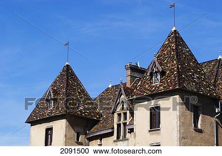 Stock Image - Detail Of The Ceramic Tiled Roof Of The Chateau Marguerite Bourgogne, Couches, Burgundy, France.. Fotosearch