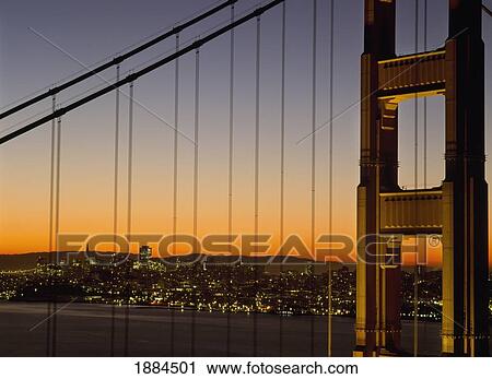 Stock Image - Detail Of The Golden Gate Bridge At Dawn With San Francisco Behind. Fotosearch