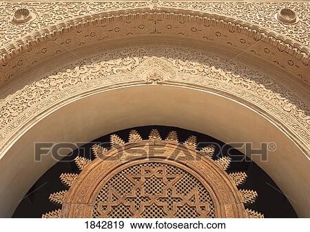Stock Photo - Detail Of Wooden Lattice And Stucco Work On Doorway At Ali Ben Youssef Medersa; Marrakech, Morocco. Fotosearch