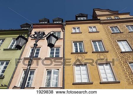 Detailed facades on burgher houses in Zamkowy Square (Plac Zamkowy) which were rebuilt after the Second World War and now form the UNESCO World Heritage Site Old Town district of Warsaw, Poland View Large Photo Image Stock Photo - Detailed facades on burgher houses in Zamkowy Square (Plac Zamkowy) which were rebuilt after the Second World War and now form the UNESCO World Heritage Site Old Town district of Warsaw, Poland. Fotosearch