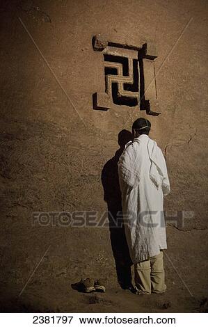 Stock Photo - Details of nighttime worship celebrations taking place in the rock-hewn churches during Orthodox Easter; Lalibela, Ethiopia. Fotosearch