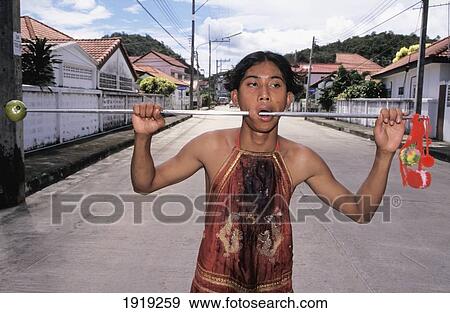 Stock Photo - Devotee At Vegetarian Festival; Phuket Island, Thailand. Fotosearch