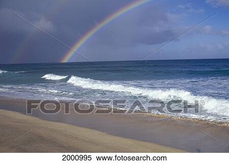 Diagonal Rainbow Over Ocean Along Horizon View From Shoreline Cloudy Sky View Large Photo Image Stock Photography - Diagonal Rainbow Over Ocean Along Horizon View From Shoreline Cloudy Sky. Fotosearch