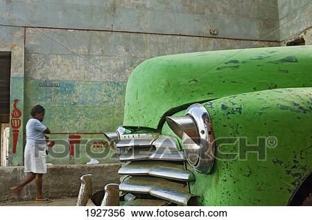Stock Photograph - Dilapidated Old Green Car, Havana, Cuba. Fotosearch