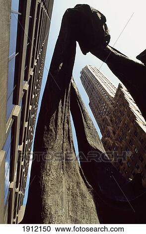 Stock Image - Dinoceras Sculpture And General Electric Building In Midtown Manhattan, New York City, New York, Usa. Fotosearch