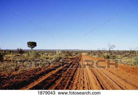 Stock Image - Dirt Road To Gosse Bluff. Fotosearch