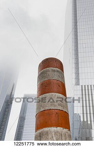 Dirty orange and white striped construction post with skyscrapers in the background; New York City, New York, United States of America View Large Photo Image Stock Photography - Dirty orange and white striped construction post with skyscrapers in the background; New York City, New York, United States of America. Fotosearch