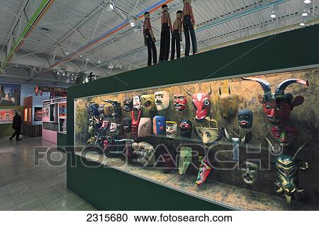 Stock Image - Display of Guatemalan Dance Masks at Museum of International Folk Art on Museum Hill; Santa Fe, New Mexico, USA. Fotosearch