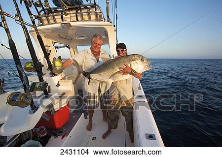 Picture - Displaying a large catch from the Indian Ocean; Vamizi Island, Mozambique. Fotosearch