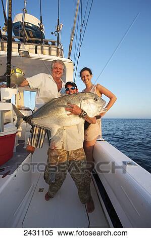 Stock Photography - Displaying a large catch from the Indian Ocean; Vamizi Island, Mozambique. Fotosearch