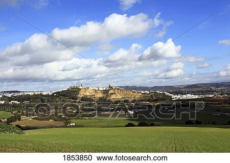 Stock Image - Distant Town Of Arcos De La Frontera, Cadiz, Spain. Fotosearch
