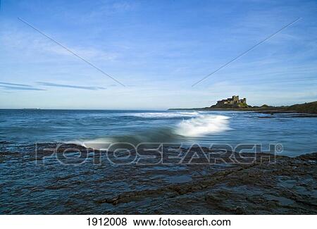 Distant View Of Bamburgh Castle, Northumberland, England, Uk View Large Photo Image Stock Photo - Distant View Of Bamburgh Castle, Northumberland, England, Uk. Fotosearch
